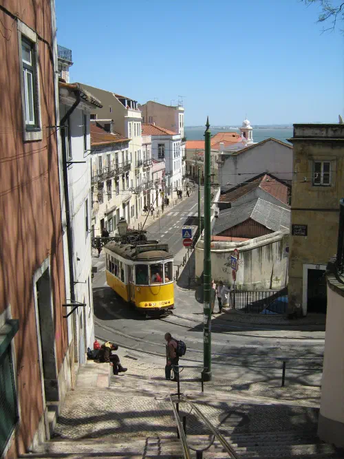A tram on a narrow, curving city street